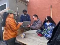 Markus Hilpert and Yoshira Ornelas Van Horne set up air monitors with high school students in the Bronx